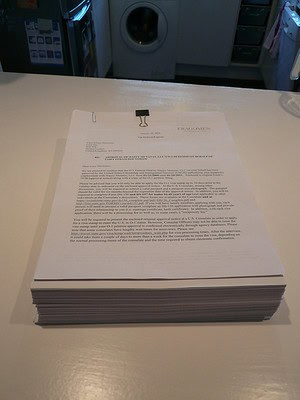 A heavy stack of paper sitting on a table.