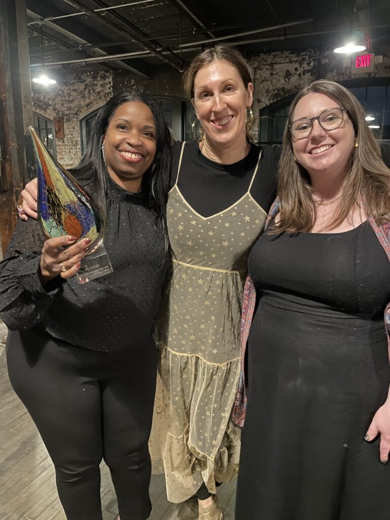 VAAC leaders celebrating our Partner of the Year Award.